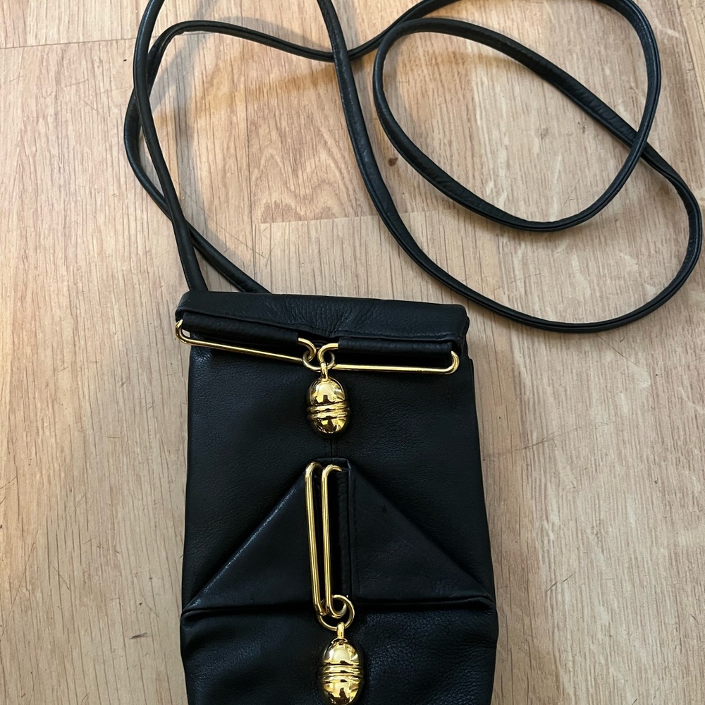 Chic Black Crossbody Bag with Gold Details
